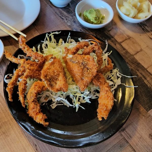 Crispy fried soft-shell crab on a bed of shredded cabbage, with wasabi and pickled ginger.